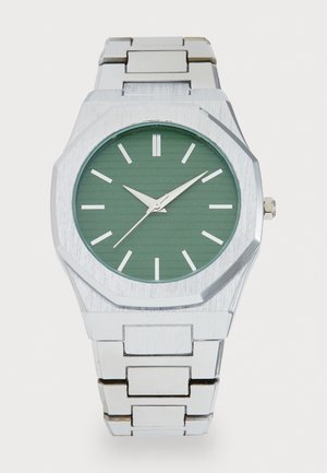 Silver stainless steel watch with an octagonal case, green textured dial, silver hour markers, and an adjustable link bracelet.