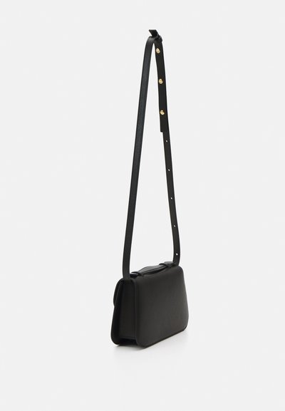 Black leather bag with a rectangular shape, a long, adjustable strap, and a smooth texture. Features a minimalistic design with no visible hardware.