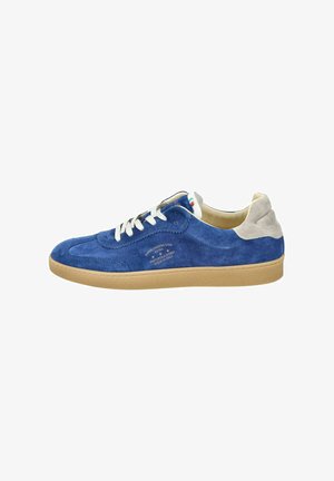 Blue suede sneaker with a beige heel, white laces, and a textured sole. Features branding on the side in white print.