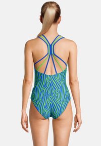 Vue arrière d'un maillot de bain une pièce avec un motif zèbre bleu et vert, des bretelles multicolores et un design épuré.