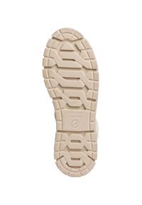 Semelle en caoutchouc avec une surface beige texturée dotée de profondes rainures et motifs pour une meilleure traction. Comprend un logo sur la semelle intermédiaire.