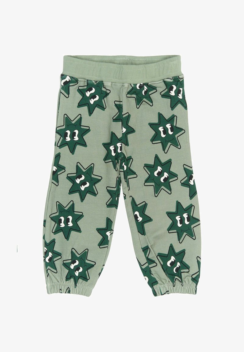 Pantaloni jogger din bumbac verde, cu modele în formă de stea și ochi. Au un brâu elastic și manșete strânse la gleznă.