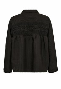 Melnā ribota jaka ar apkaklītes kakla izgriezumu, savilktu muguras dizainu un garām piedurknēm, ar teksturētu audumu brīvā piegriezumā.