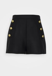 Shorts noirs taille haute avec six grands boutons dorés, trois de chaque côté, couture centrale avant et large ceinture.