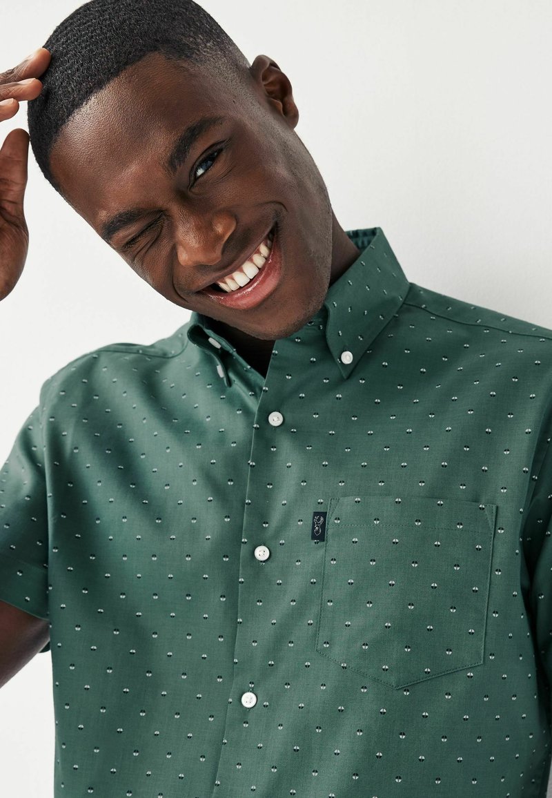 green emerald velvet dress ₹899 | Campus Sutra men's Pistachio Green Polka Dot Shirt