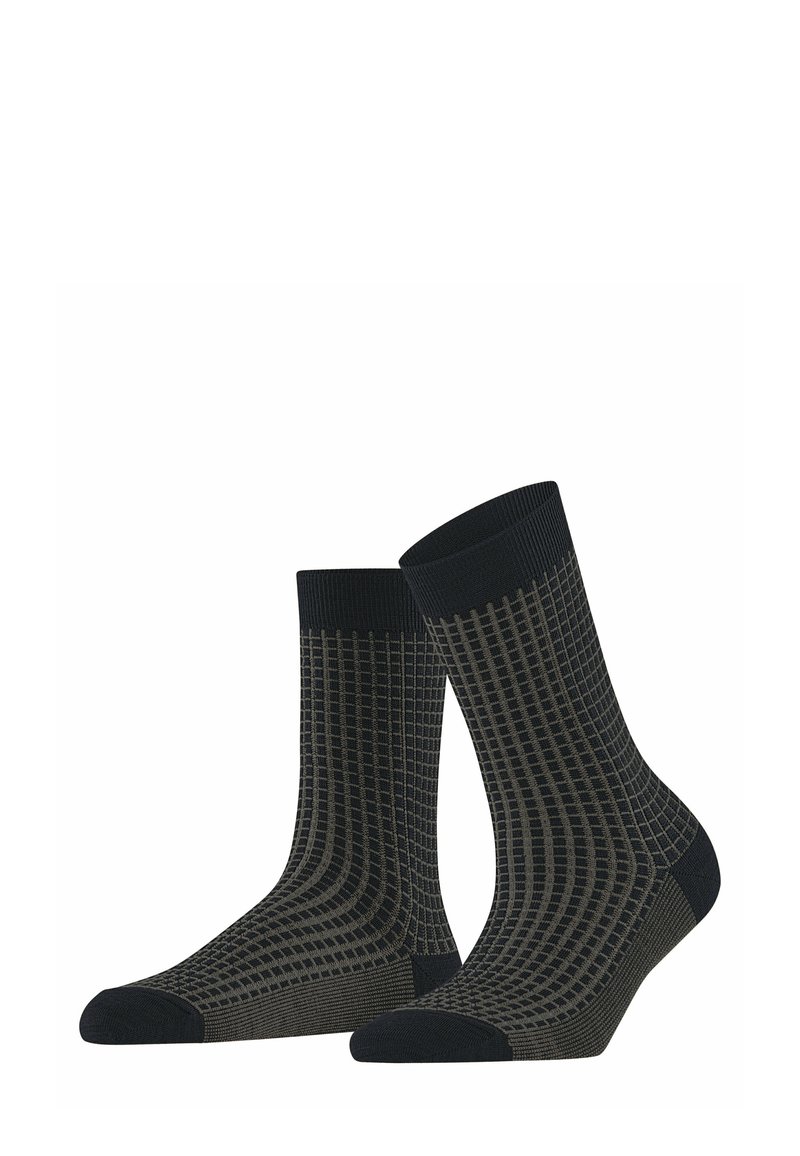 Grüne und schwarze Socken mit Muster, die ein Rautendesign aufweisen, mit gerippten Bündchen, verstärkter Zehenpartie und glatter Textur. Mittlere Wadenlänge.