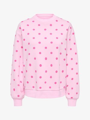 Ružičasta majica dugih rukava s okruglim izrezom i rebrastim manžetnama. Sadrži uzorak jarko ružičastih točkica na svijetloružičastoj tkanini.