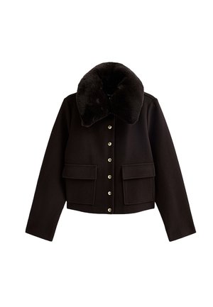 Black cropped jacket with a large fur collar, two front pockets, and silver snap buttons down the center. Soft fabric texture.