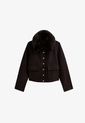 Black cropped jacket with a large fur collar, two front pockets, and silver snap buttons down the center. Soft fabric texture.