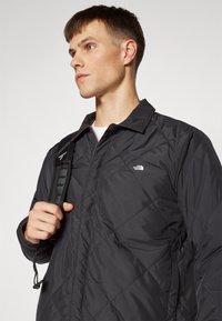 The North Face AFTERBURNER INSULATED - Jachetă outdoor - black/smokey brown