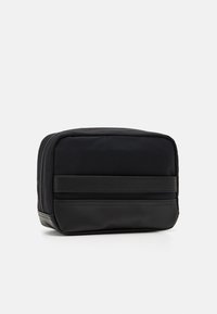 Tommy Hilfiger TEXTURE BLOCK WASHBAG UNISEX - Vrecko na pranie - black