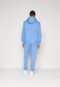 Nike Sportswear CLUB FLEECE Trainingsanzug polar/white