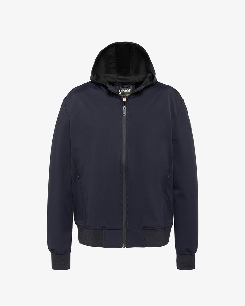 Veste à capuche bleu marine avec fermeture éclair frontale, poignets et ceinture côtelés, et poches latérales zippées.