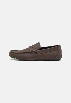 Brown leather loafer with a low profile, rounded toe, decorative stitching, and rubber sole for grip. Simple design with no visible patterns.