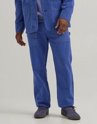 Blue corduroy jacket and pants with visible stitching, two front pockets, and a relaxed fit. Shoes are dark purple with a lace closure.