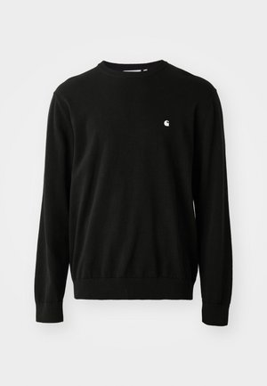 Black cotton sweater with long sleeves, round neckline, ribbed cuffs, and hem. Features a small white logo on the chest side.