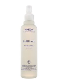 Le spray Aveda Damage Control dans une bouteille en plastique transparent avec une pompe blanche. Présente un texte bleu et une icône florale. Texture légère et lisse.