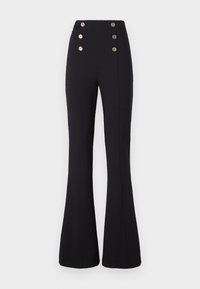 Pantalon noir évasé taille haute avec six boutons décoratifs dorés, deux coutures verticales et une silhouette ajustée.