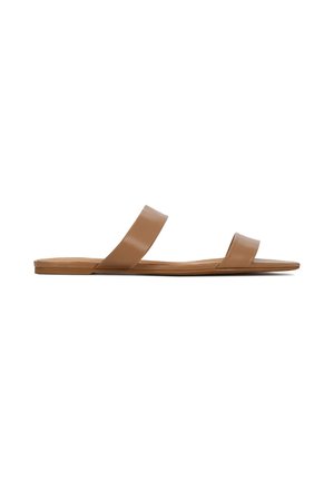Brown flat sandals with two wide, smooth straps, a minimalist design, and a flat sole. The material appears to be synthetic and flexible.