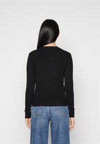 Calvin Klein Jeans Stickad tröja - black