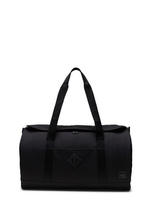 Sac de sport noir en tissu durable avec deux poignées robustes, une fermeture éclair et un patch logo en caoutchouc sur le devant. Texture lisse.