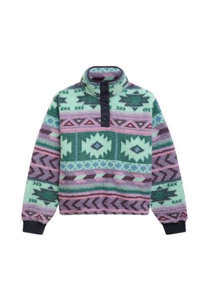 Bluza polarowa z wysokim kołnierzem i zatrzaskami, zdobiona wielokolorowymi wzorami geometrycznymi w odcieniach zieleni, fioletu, różu i niebieskiego.