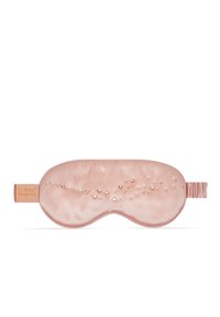 Jedwabna opaska na oczy do spania w miękkim różowym kolorze o gładkiej fakturze, z wzorem kropek po jednej stronie i elastycznym paskiem zapewniającym komfort.