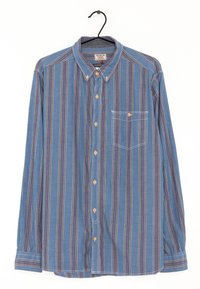 Camicia blu a maniche lunghe con bottoni, caratterizzata da strisce verticali di vari colori, una tasca sul petto e colletto con bottoni. Materiale misto cotone.