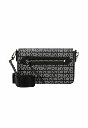 Black crossbody bag with all-over white DKNY logo print, front zipper pocket, black adjustable strap, and silver-tone hardware.