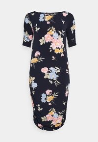 Sinih sininen polvipituinen mekko, jossa on vaaleanpunaisia, keltaisia ja sinisiä kukkakuoseja, lyhyet hihat ja hieman rypistynyt helma sivuilla.