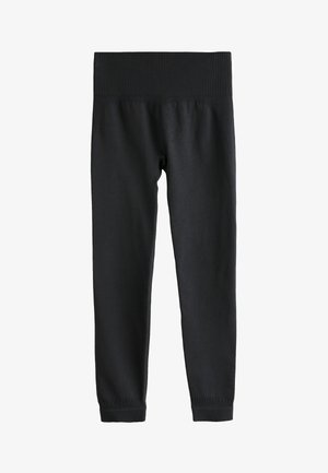 Leggings noirs en tissu lisse et extensible. Dotés d'une large ceinture côtelée et de jambes ajustées avec des poignets côtelés aux chevilles.
