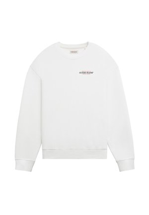 White sweatshirt with round neckline, long sleeves, and ribbed cuffs. Features a small black "GUESS JEANS" logo on the chest. Smooth texture.