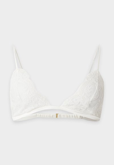 Λευκό δαντελένιο bralette με ρυθμιζόμενους λεπτούς ιμάντες ώμου και μικρό κούμπωμα στο πίσω μέρος, με λεπτομέρειες κεντήματος με λουλούδια.