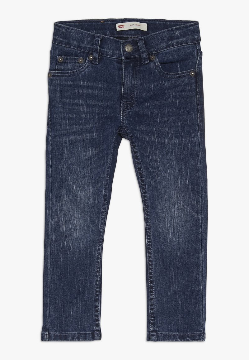 Dunkelblaue Skinny Jeans aus Denim mit glatter Textur. Verfügt über fünf Taschen, Metallbeschläge und einen klassischen, mittelhohen Taillenbund.