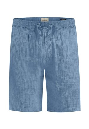 Blå, teksturerte shorts med elastisk midjebånd og snøring. Har sydd linjer og en uformell, løs passform.