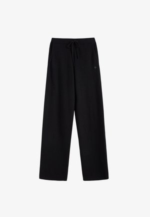 Losse zwarte broek met een elastische tailleband en een verstelbaar trekkoord, met zijzakken en een klein logo.