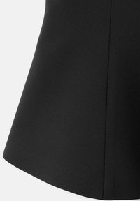 Black fabric with a smooth texture, featuring a flared lower edge and subtle seam detailing. No patterns or hardware visible.