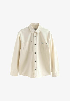 Beige overhemd met lange mouwen, een button-down kraag, twee borstzakken en zwarte knopen. Gemaakt van een zachte, gladde stof.