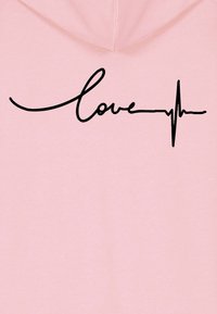 Felpa rosa con testo in corsivo nero "love" integrato con una linea del battito cardiaco. Tessuto morbido con un design rilassato.