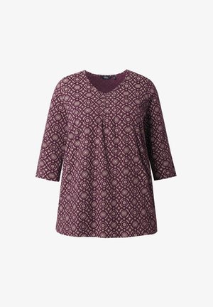 Bordeaux-bluse med V-hals, trekvartærmer og et cirkulært hvidt mønster over det hele. Blødt stof med en afslappet pasform.