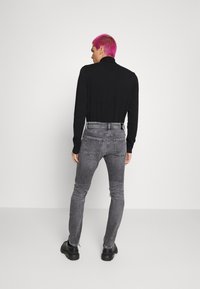 Calvin Klein Jeans SKINNY - Calças de ganga de corte skinny - denim black