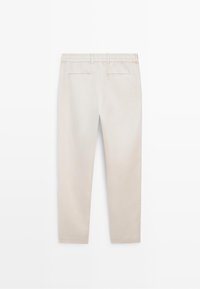 Beige straight-leg trousers with elastic waistband, belt loops, and two back welt pockets on a white background.