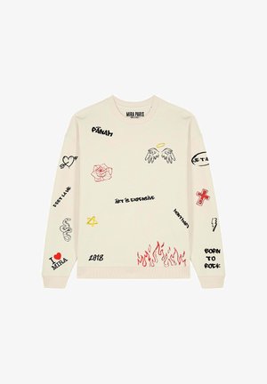 Kreemjavärvi dressipluus, millel on mitmesugused trükitud mustrid, sealhulgas lilled, südamed, maod ja musta ning punase tekst, pehmel tekstuuril.