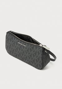 Black textured crossbody bag featuring a monogram pattern, silver hardware, and a zip closure. Compact design with a detachable strap.