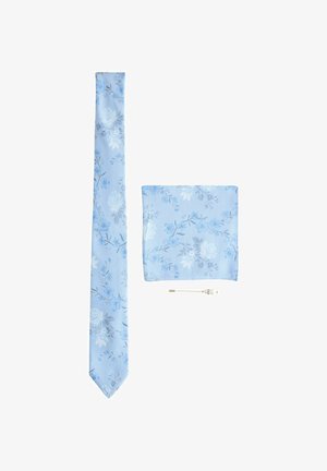 Light blue tie and pocket square set with delicate floral patterns, accompanied by a silver lapel pin with small bead details.