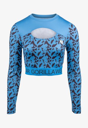 Blauwe langemouwen crop top met zwart dierenprint, voorzien van een uitsnede bij de halslijn en een contrasterende blauwe logoband aan de onderrand.