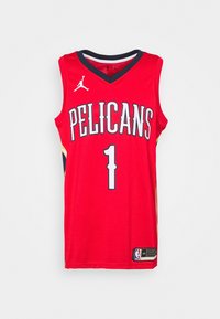 Red basketball jersey with "PELICANS" text in gray, number "1" in white. Features a round neck, mesh fabric, and Jordan logo on the shoulder.