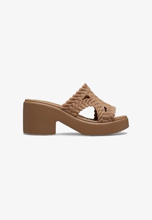 Brown molded sandals featuring woven straps, a chunky block heel, and a textured footbed. Smooth finish with subtle detailing.