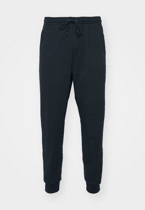 Nike Performance PRIMARY PANT - Tracksuit bottoms - black