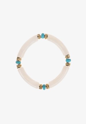 Bracelet à perles composé de pièces en céramique blanche incurvées, de pierres turquoise et d'accents dorés, formant un design circulaire.